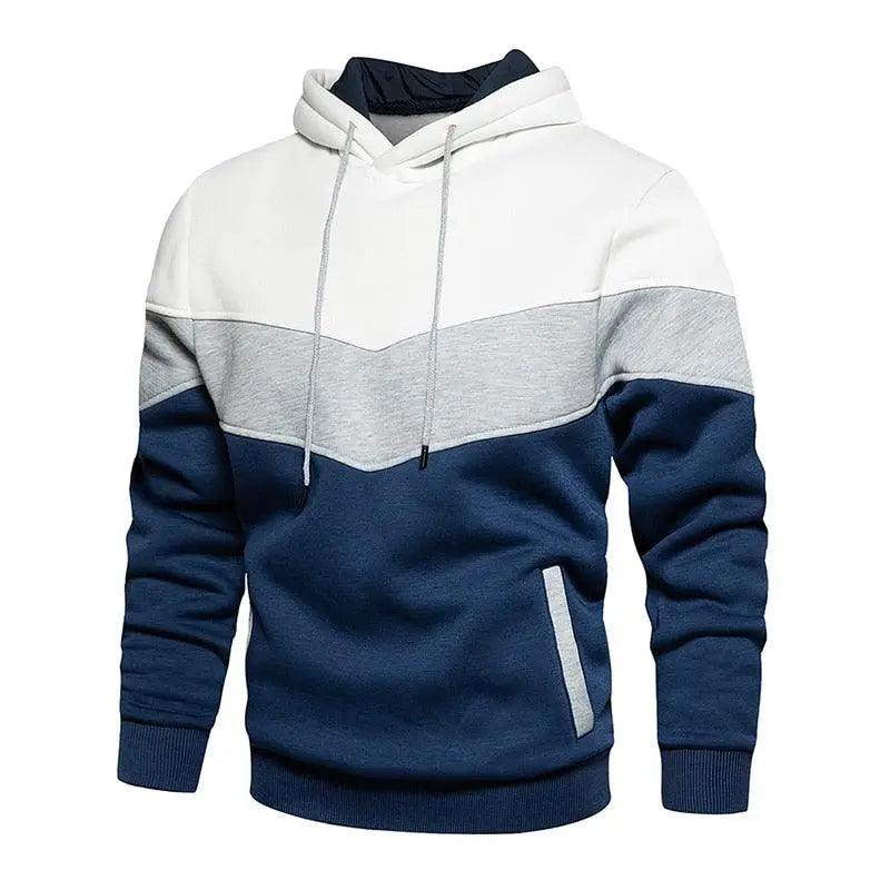 Men wearing a modern patchwork knit hooded sweatshirt in yellow, white, and blue, styled for casual streetwear.