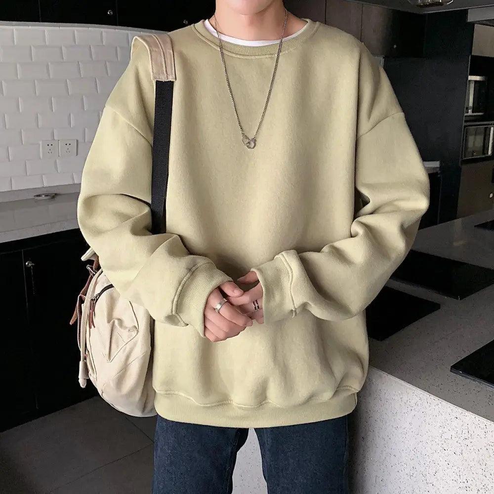 A simple solid color crewneck sweatshirt for men and women with long sleeves