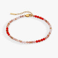 Coral and pink ombre beaded anklet featuring faceted semi-precious stones in a gradient style.