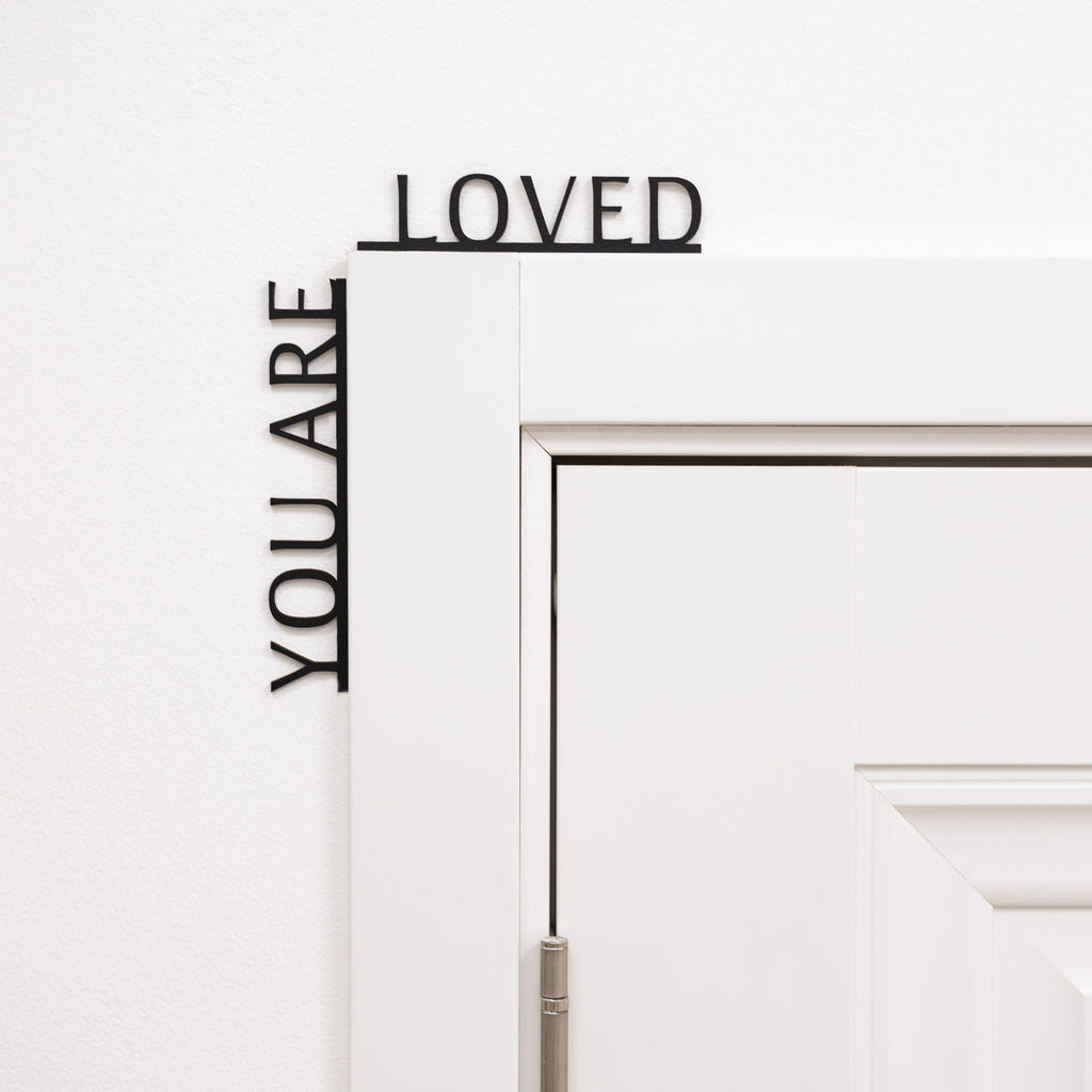Wooden corner wall decor with the text You Are Loved, perfect for a nursery or kids room.