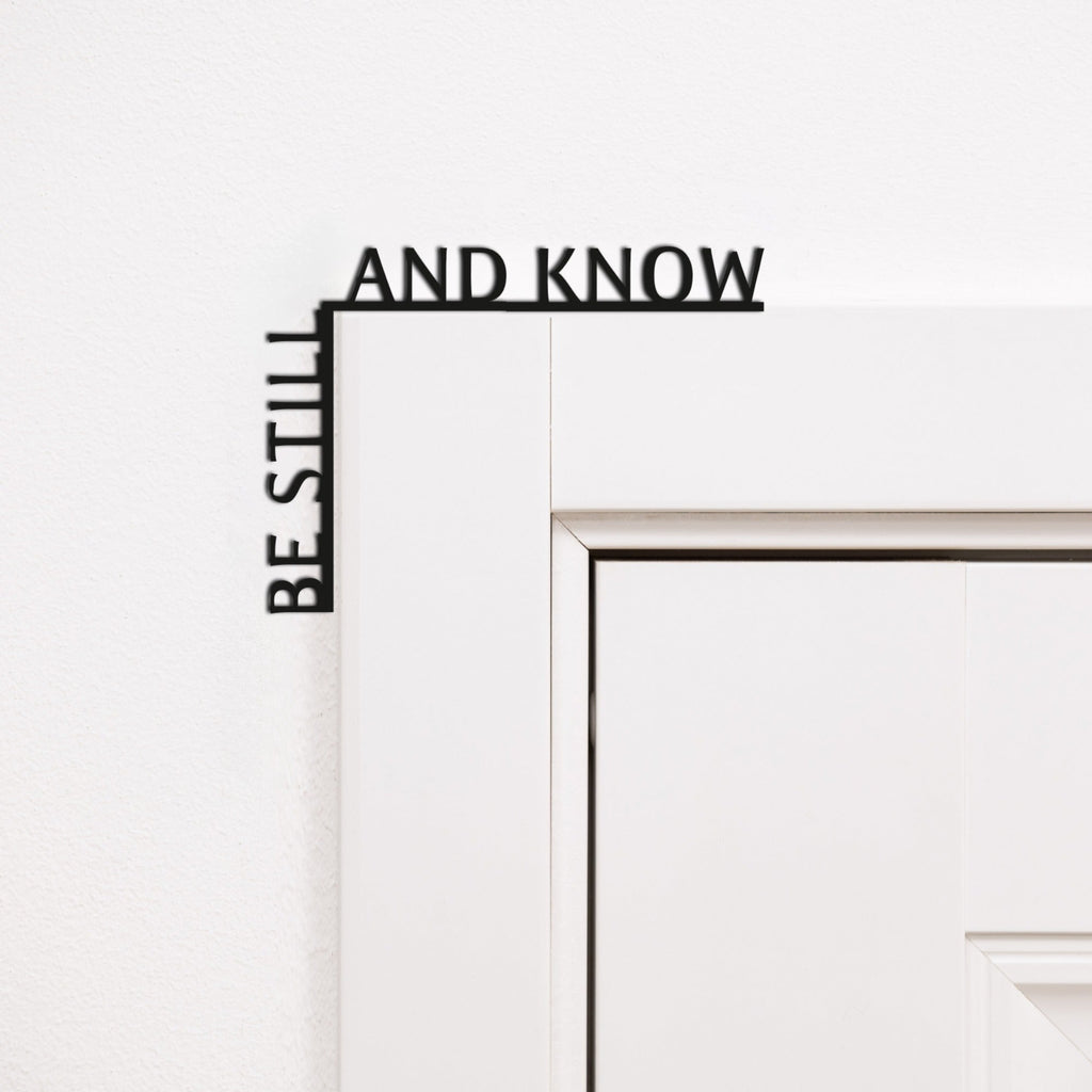 Wooden Be Still and Know wall inscription mounted in a room corner for home mindfulness decor