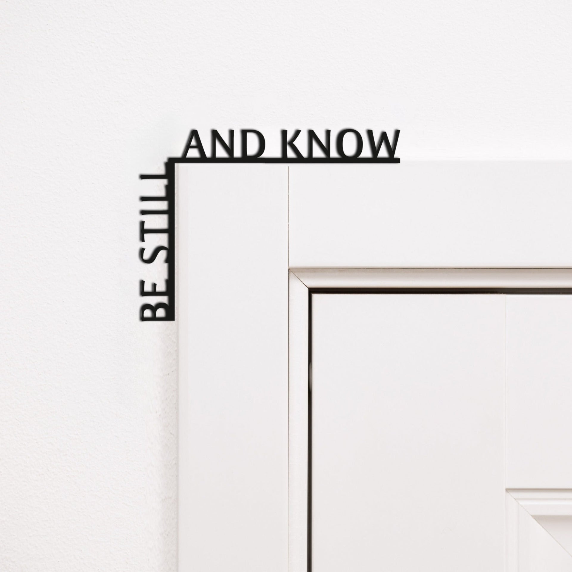Wooden Be Still and Know wall inscription mounted in a room corner for home mindfulness decor