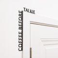 Minimalist black Coffee Before Talkie wooden corner quote installed in a kitchen.