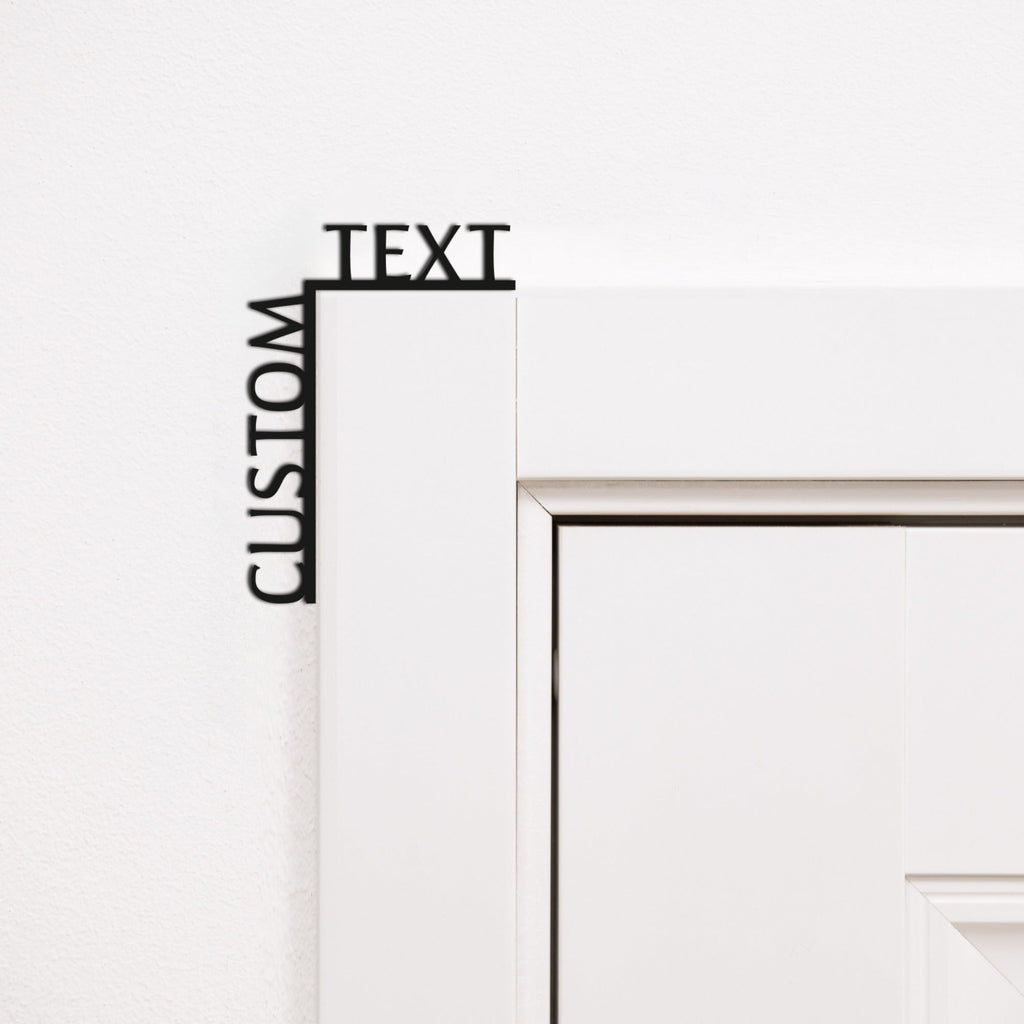 Customizable black wooden wall art quote installed on a room corner.