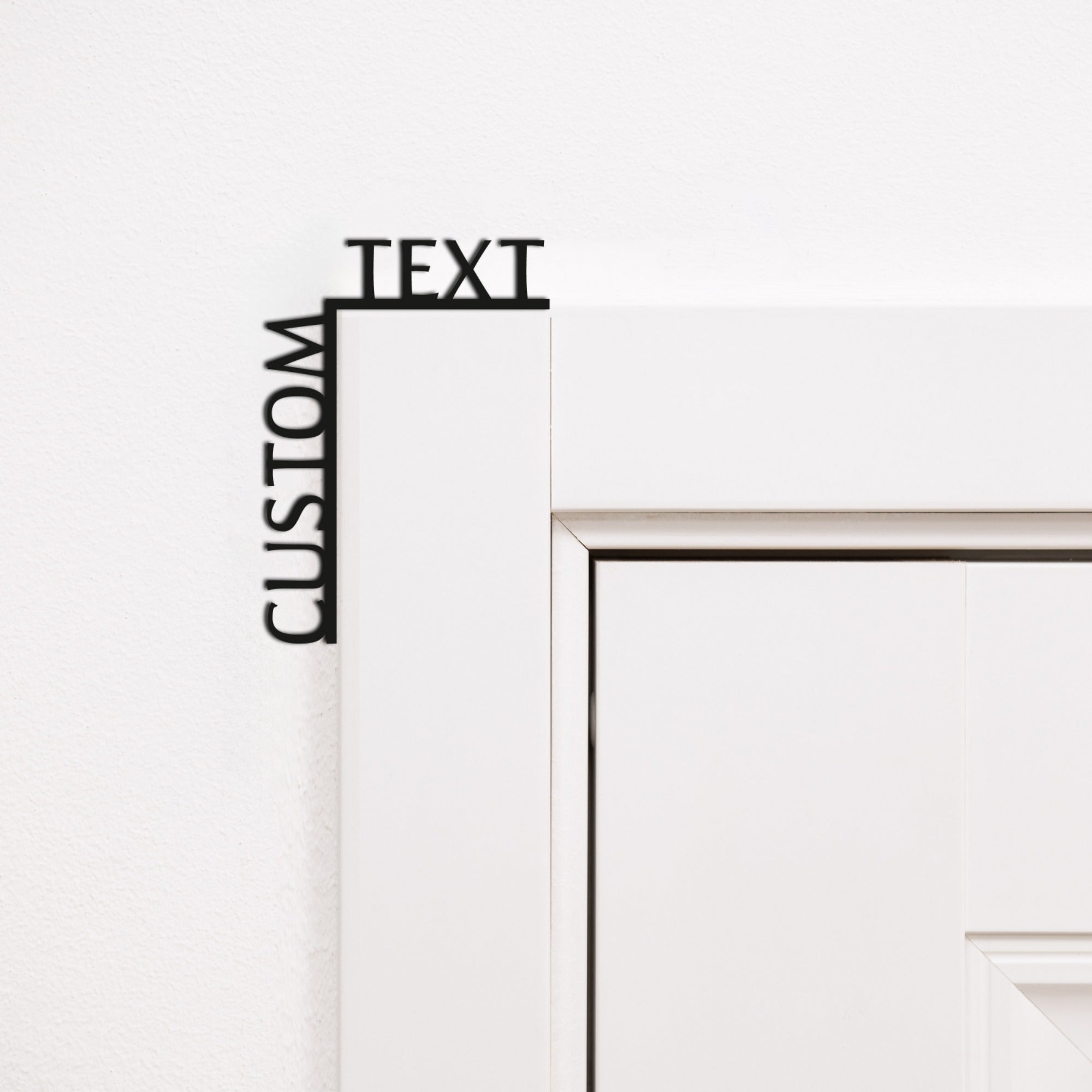 Customizable black wooden wall art quote installed on a room corner.