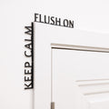 Funny black wooden bathroom sign reading Keep Calm Flush On.