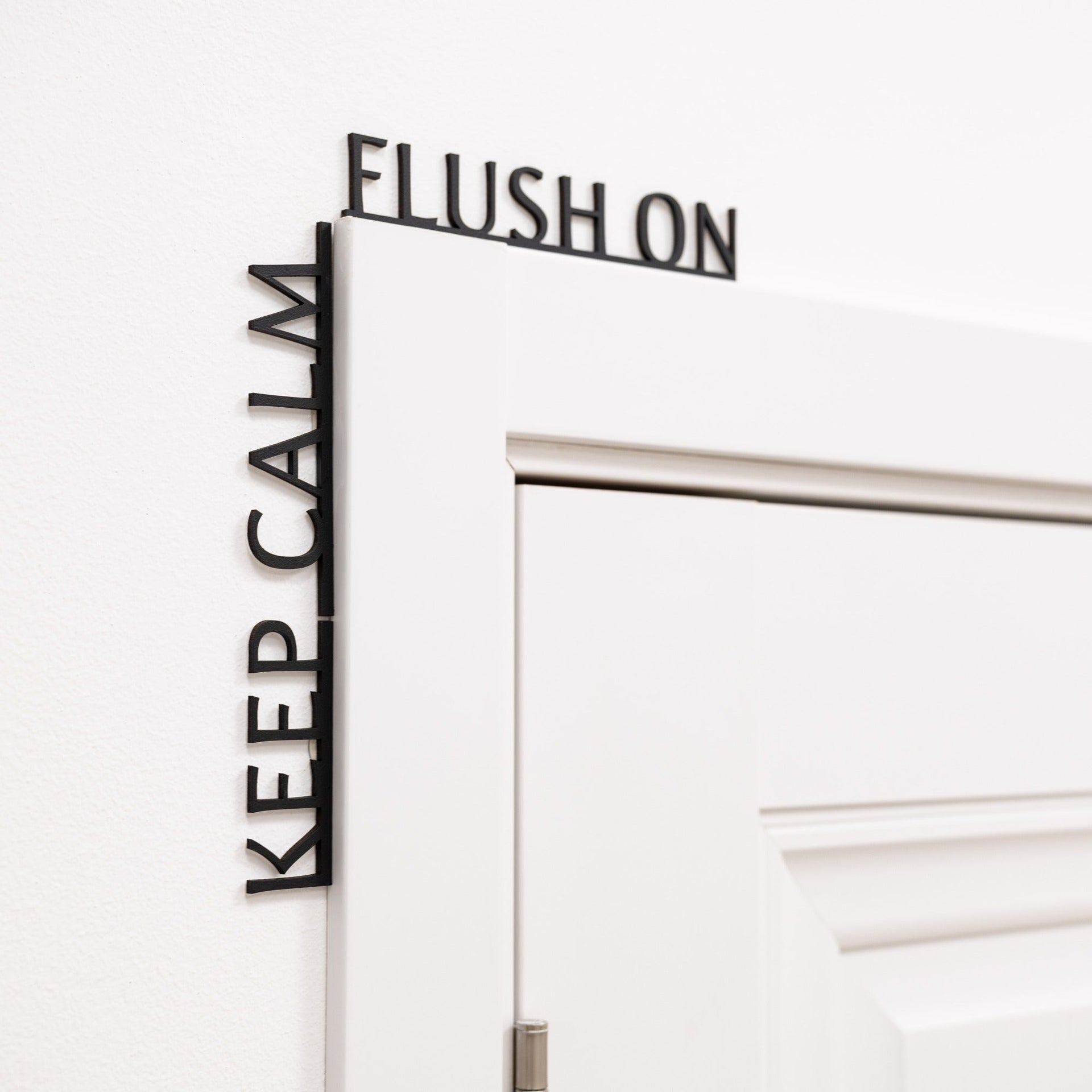 Funny black wooden bathroom sign reading Keep Calm Flush On.