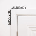 Wooden corner wall inscription text that reads Miss You Already for home entryway decor