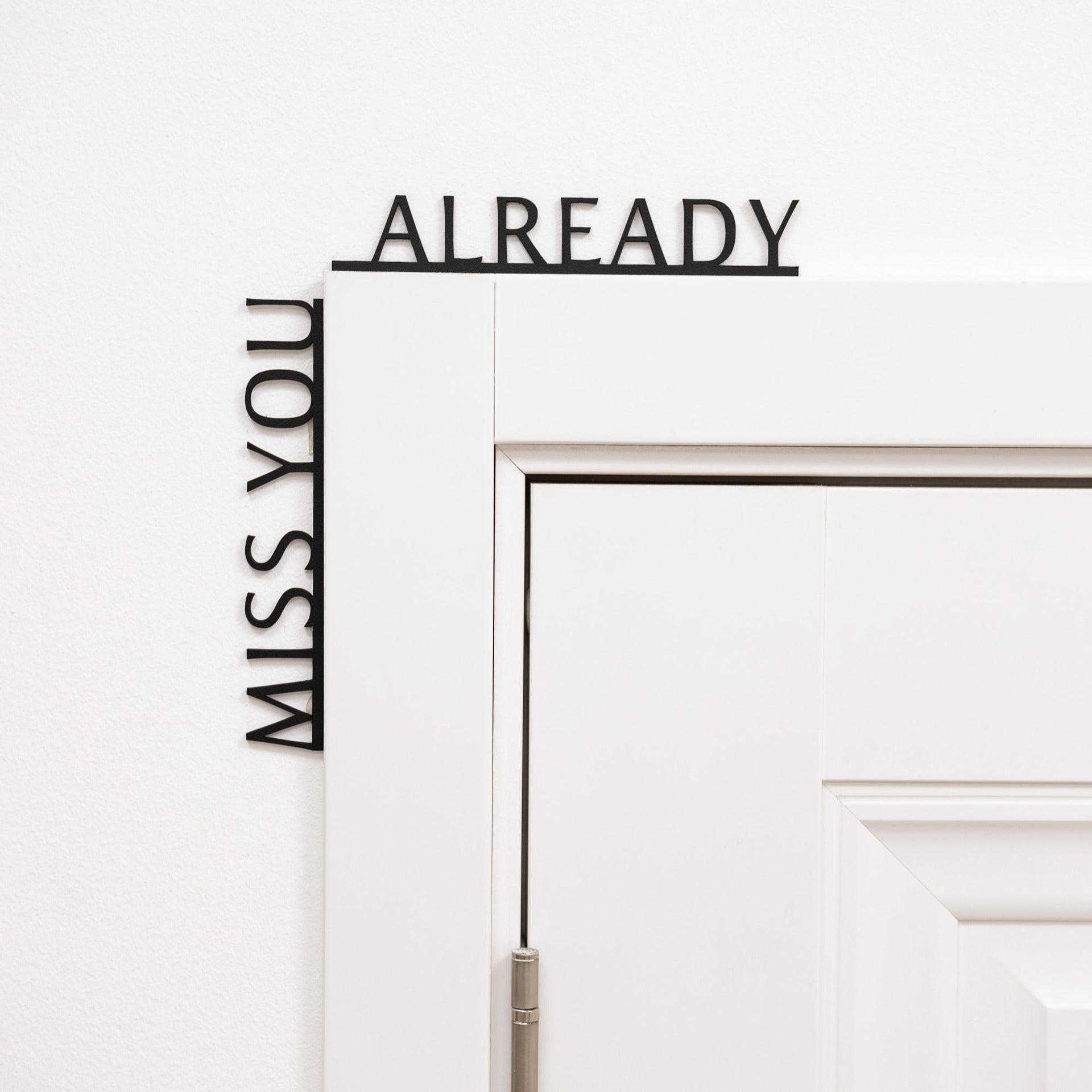 Wooden corner wall inscription text that reads Miss You Already for home entryway decor