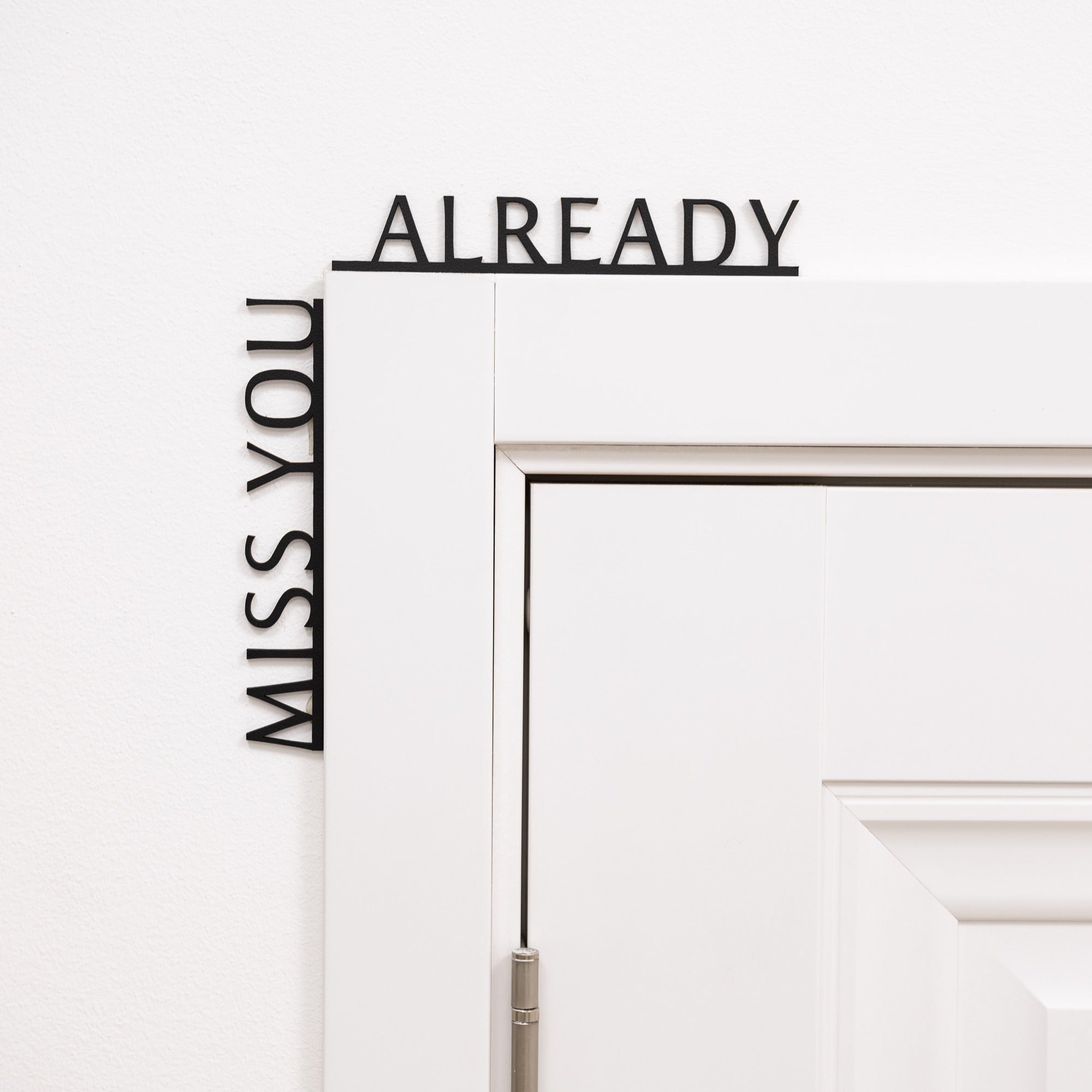 Wooden corner wall inscription text that reads Miss You Already for home entryway decor