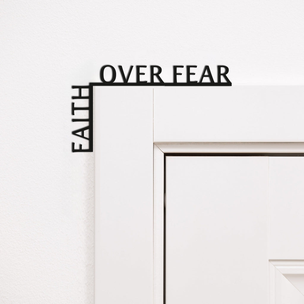 Minimalist black wooden corner quote reading 'Faith Over Fear' for inspirational wall decor.