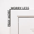 Wooden corner inscription reading Pray More, Worry Less, elegantly displayed as home decor.