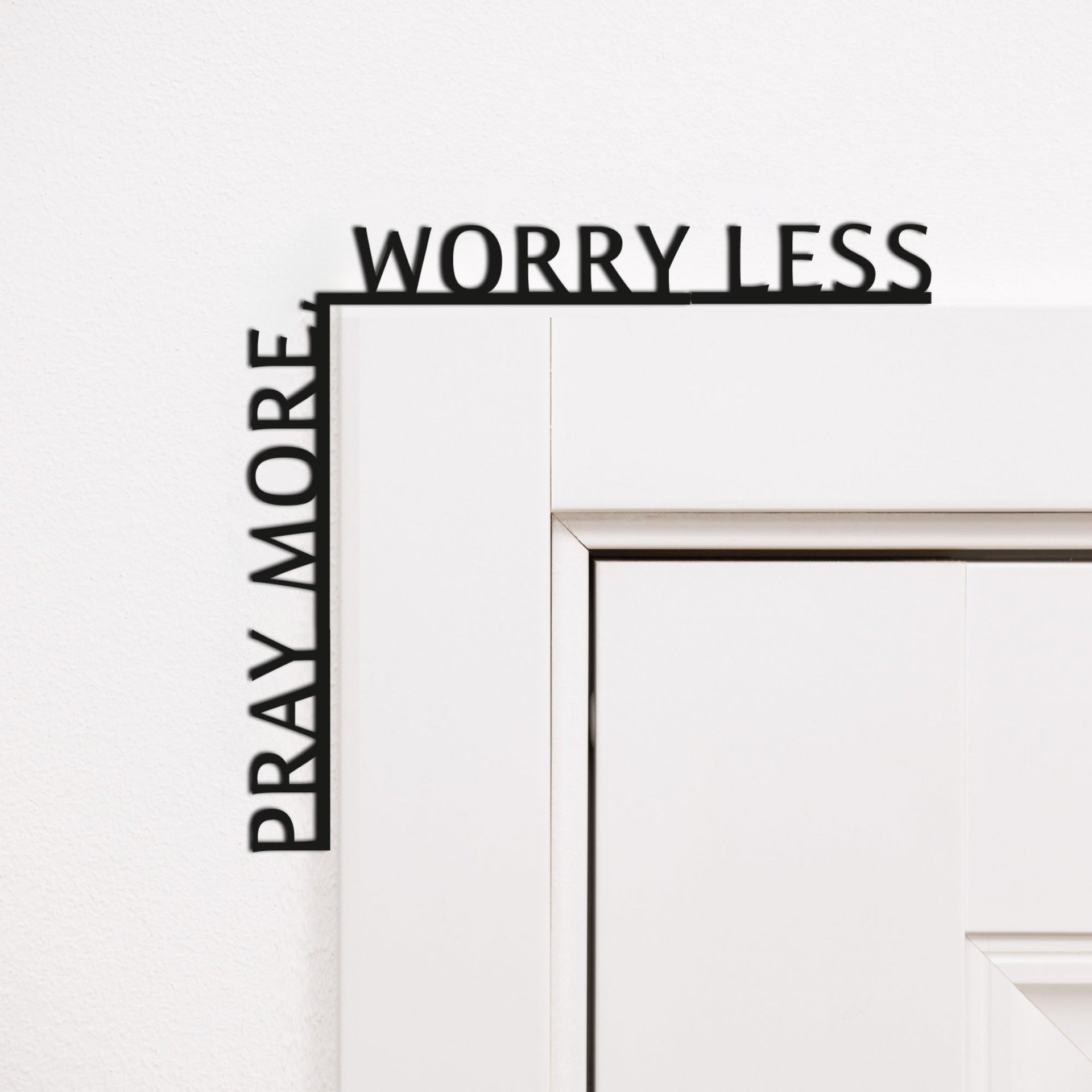 Wooden corner inscription reading Pray More, Worry Less, elegantly displayed as home decor.