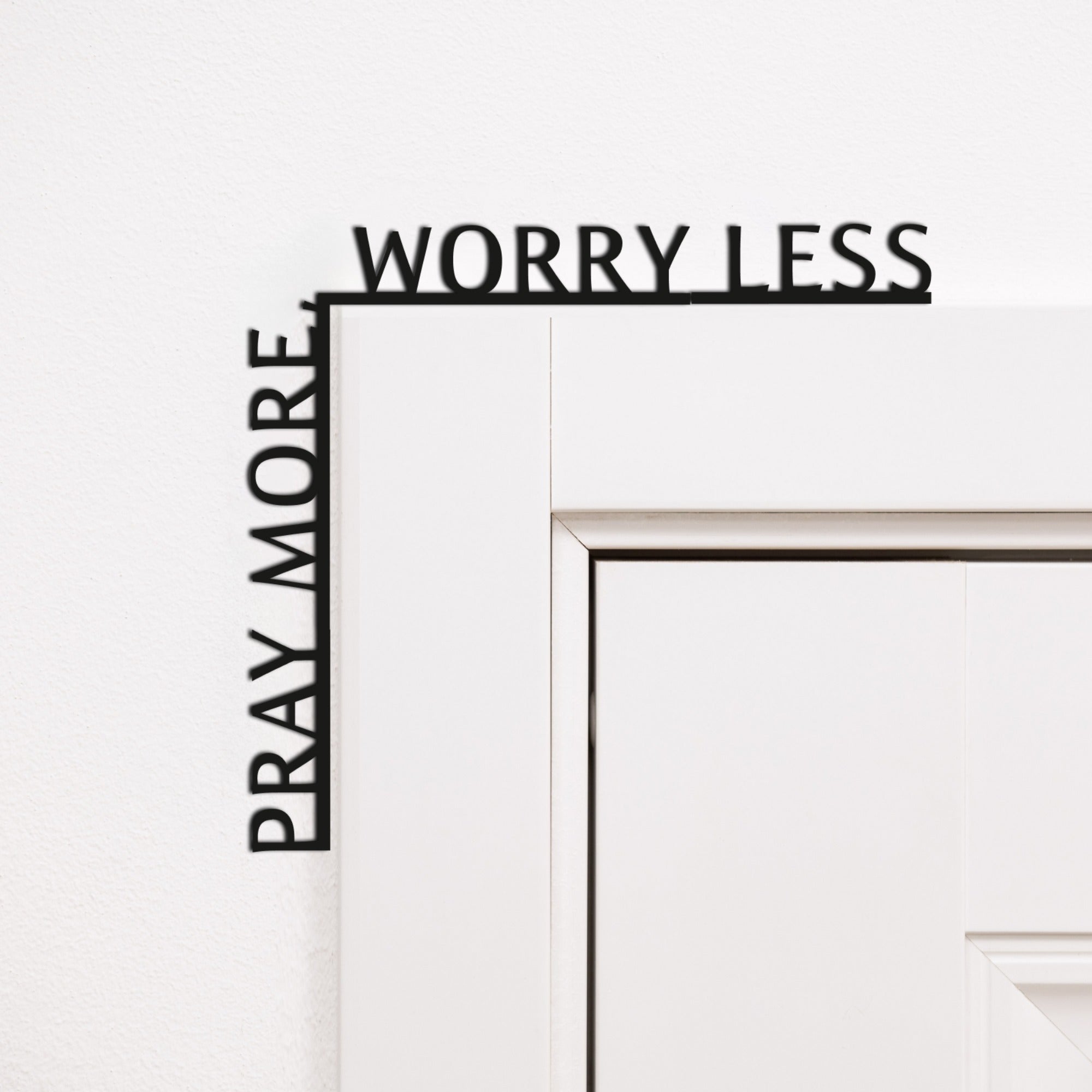 Wooden corner inscription reading Pray More, Worry Less, elegantly displayed as home decor.