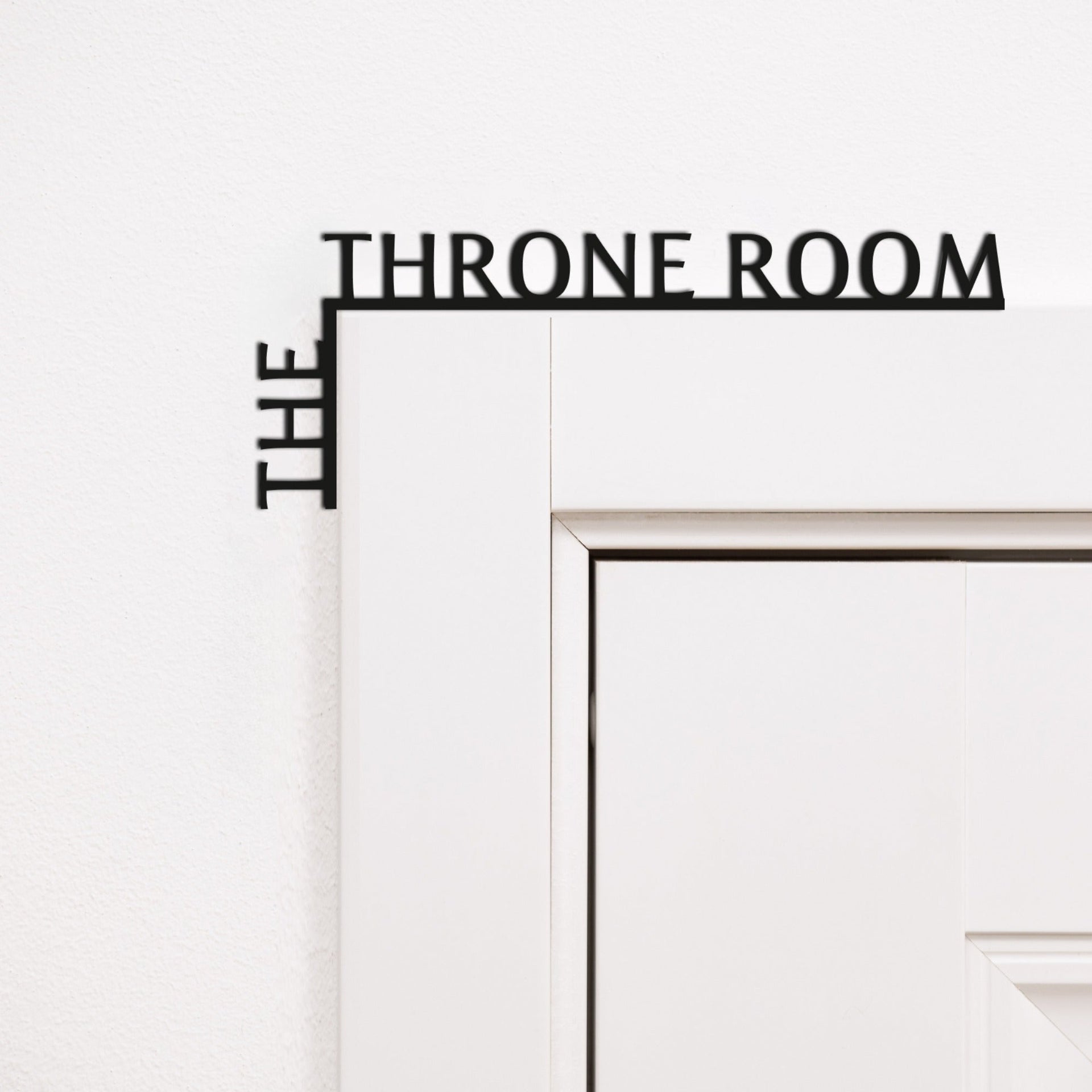 Black wooden corner quote reading 'The Throne Room' for modern bathroom wall decor.