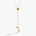 Cosmic Cowgirl Y Necklace with gold and silver charms, stars, moons, and crystals on a cable chain
