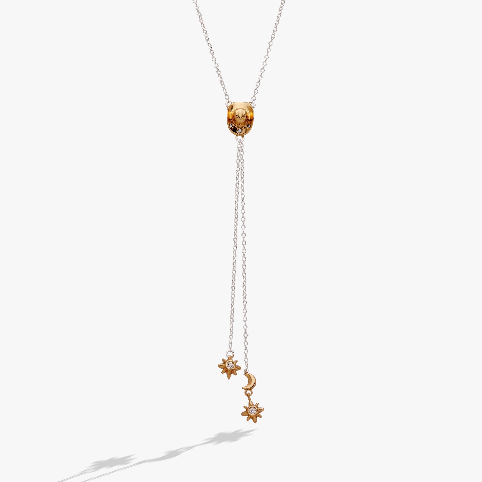 Cosmic Cowgirl Y Necklace with gold and silver charms, stars, moons, and crystals on a cable chain