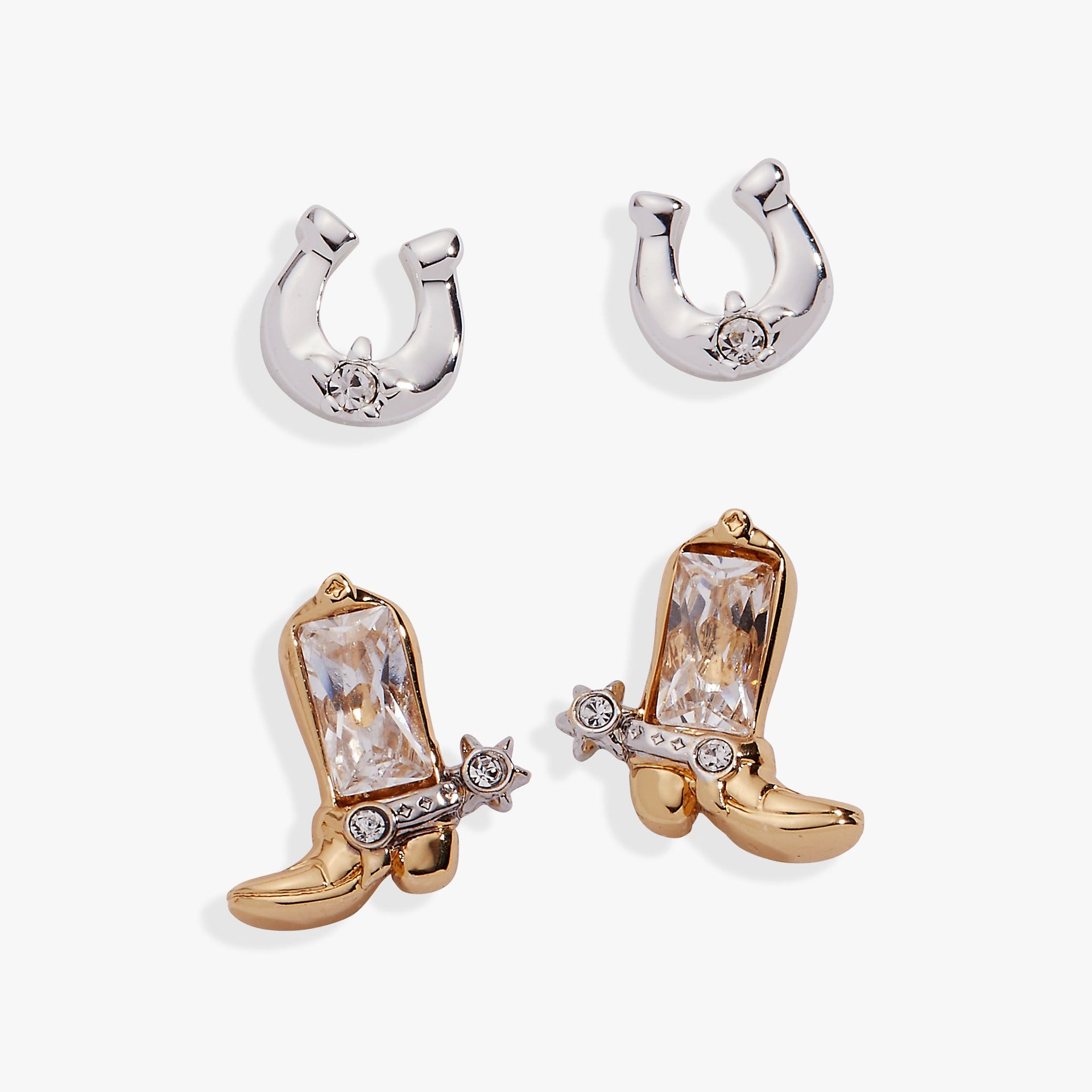 Mixed metal Cosmic Cowgirl stud earring set featuring a silver horseshoe and gold boot with clear crystal accents.
