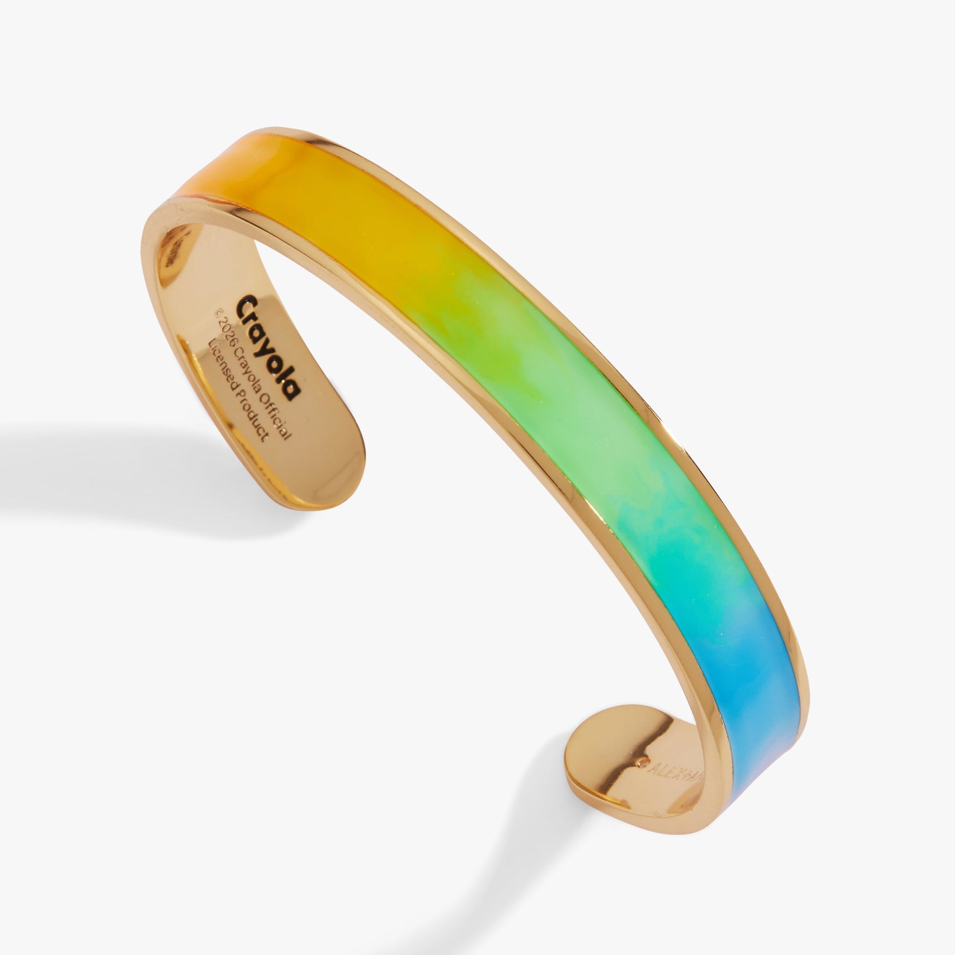 Close-up of a colorful rainbow gradient resin cuff bracelet with shimmer ombre effect.