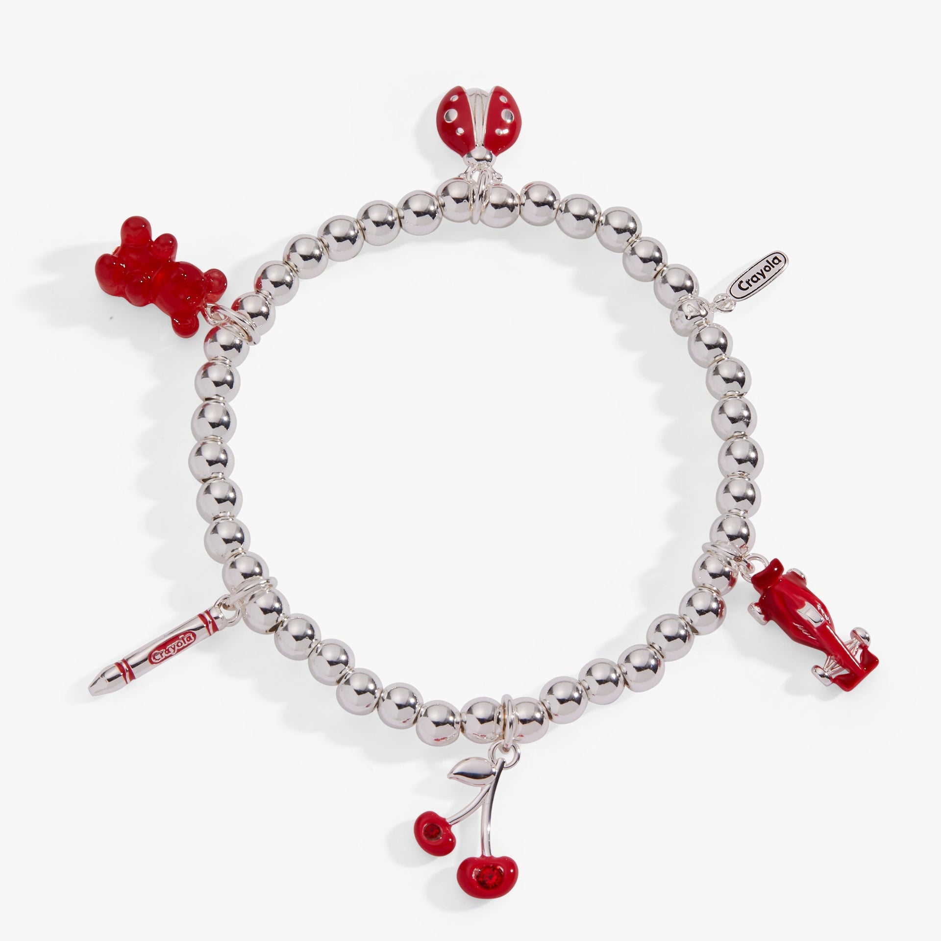 Gold-tone stretch bracelet with Crayola-themed scarlet red charms and a gummy bear.