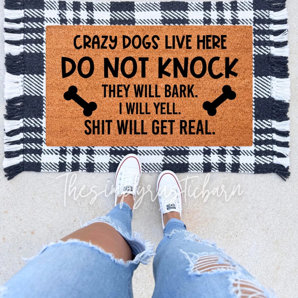 Crazy Dogs Live Here natural coir doormat with rubber backing