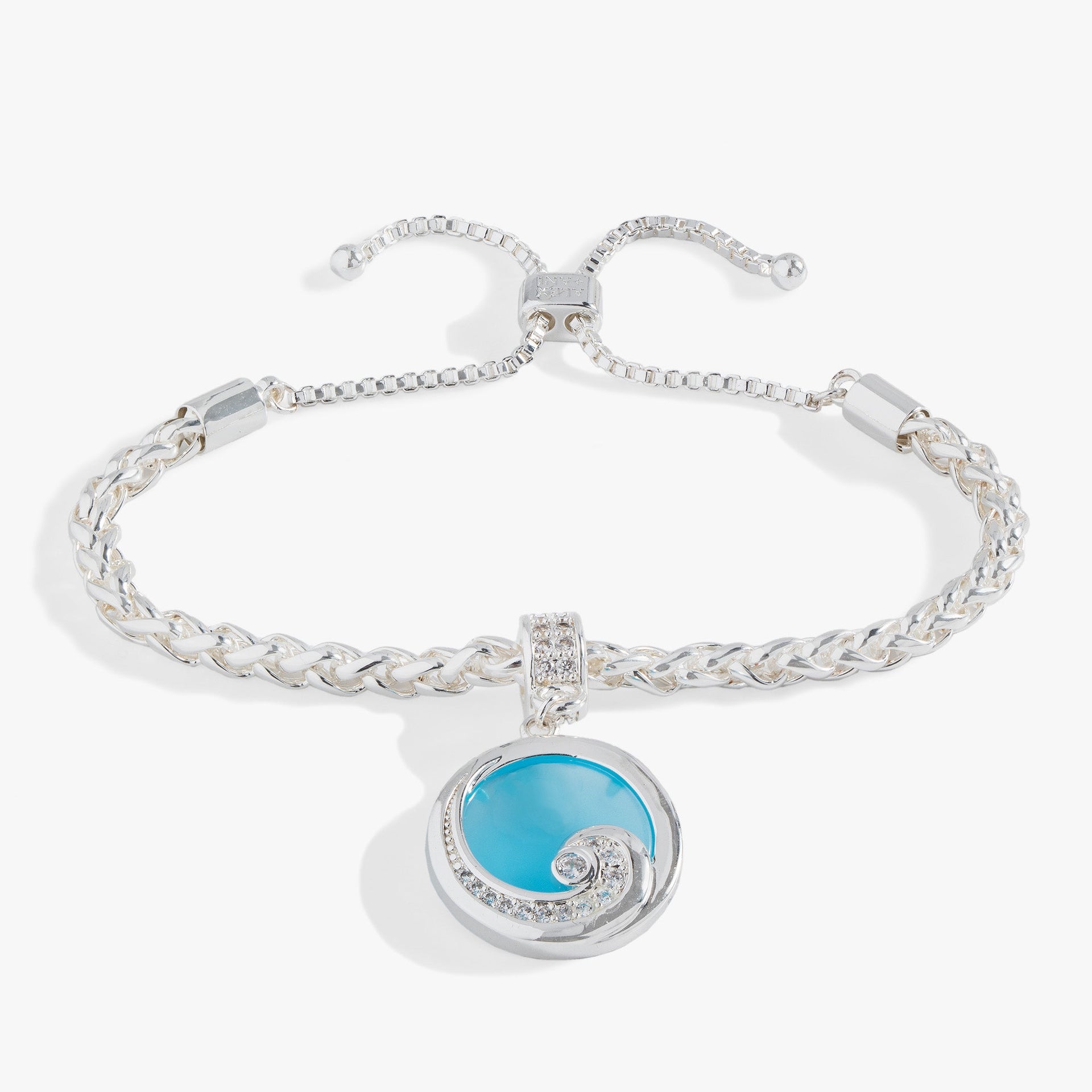 Silver bolo bracelet with a blue opal-colored charm and crystal-encrusted wave motif.