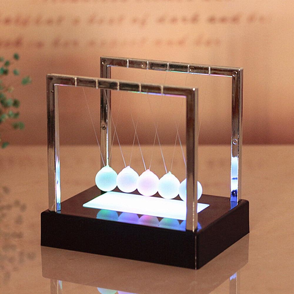 Modern magnetic levitation swing ball LED desk ornament in silver and black