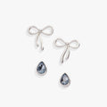 A set of Bow & Teardrop stud earrings in silver, gold, and blue finish against a neutral background.