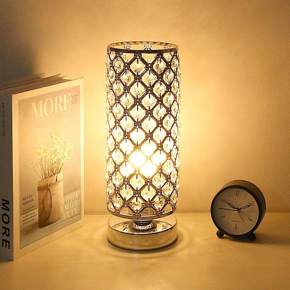 Silver bedside table lamp with K5 crystals glowing on a modern nightstand