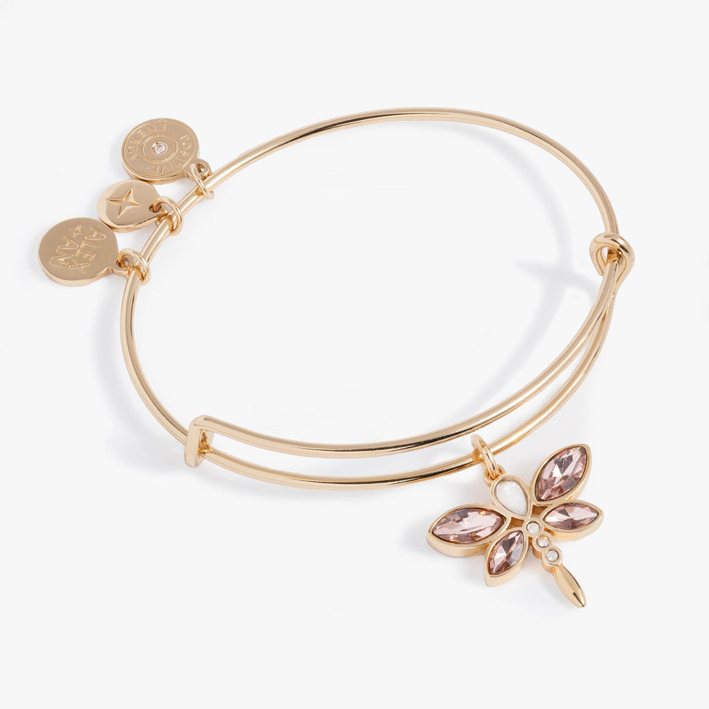 Gold-tone bangle featuring a dragonfly motif with light rose marquise, teardrop, and round-cut crystals