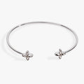 Silver flex cuff bracelet featuring sparkling navette clear crystals and a star logo accent.