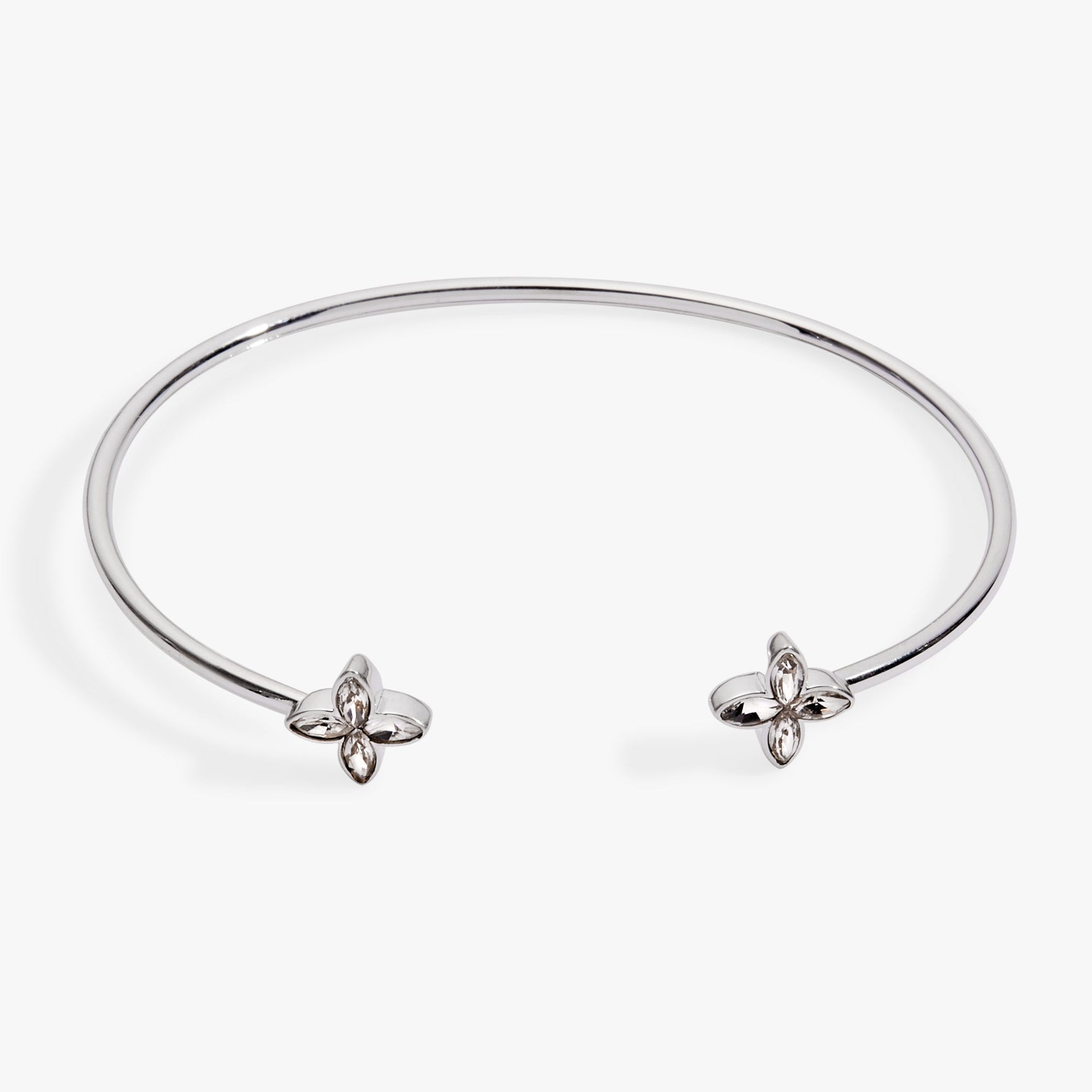 Silver flex cuff bracelet featuring sparkling navette clear crystals and a star logo accent.