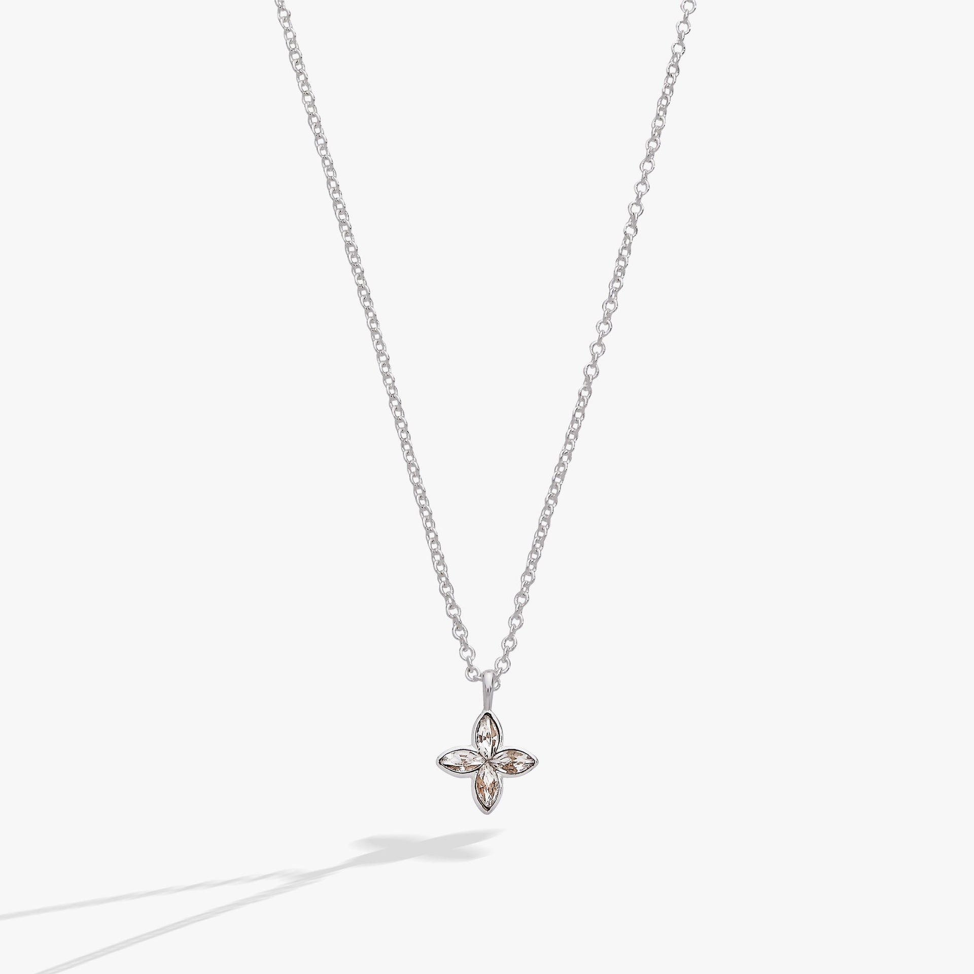 Minimalist silver necklace featuring a marquise-cut clear crystal star pendant on a delicate cable chain