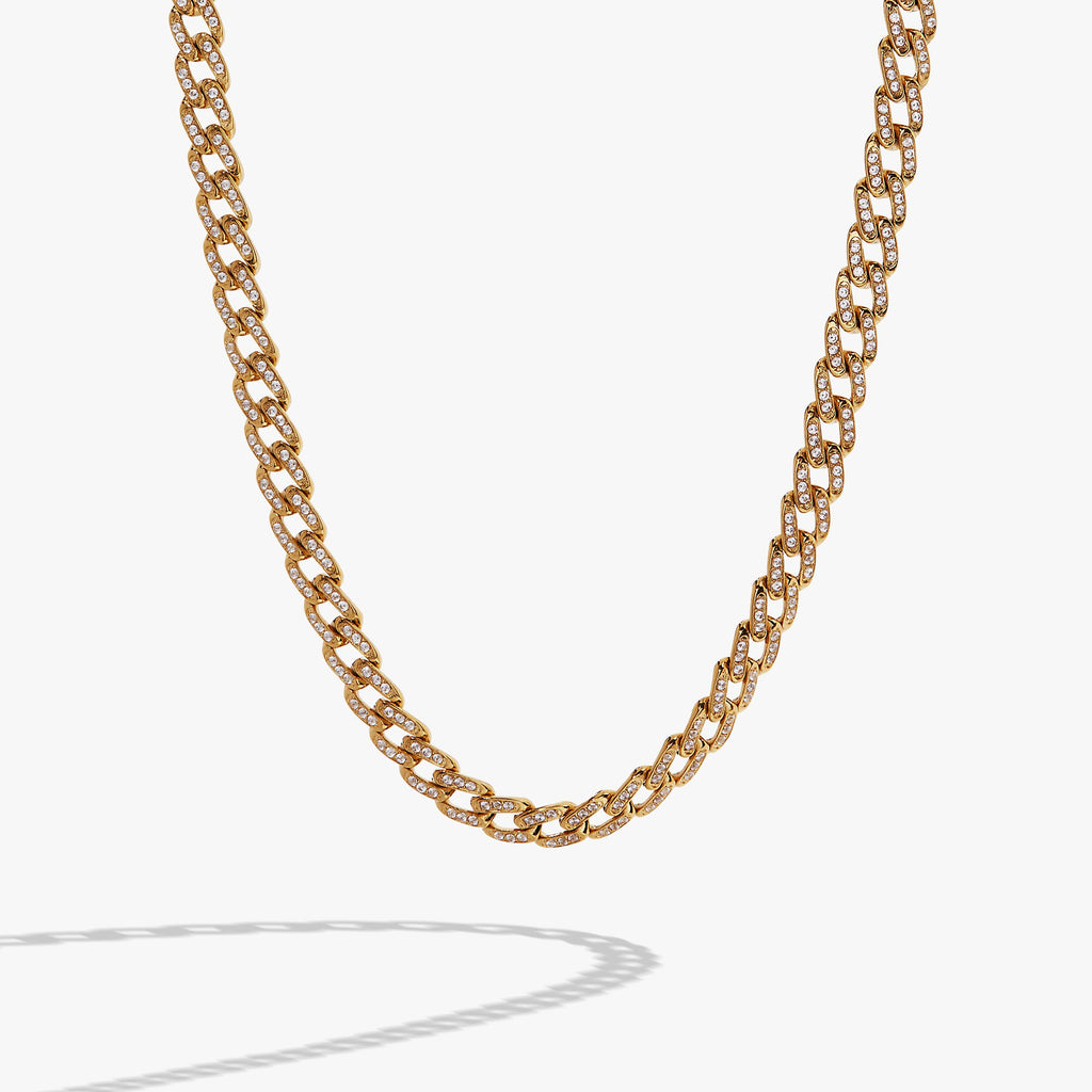 Gold chunky curb chain necklace with pave crystal accents styled for modern glamour