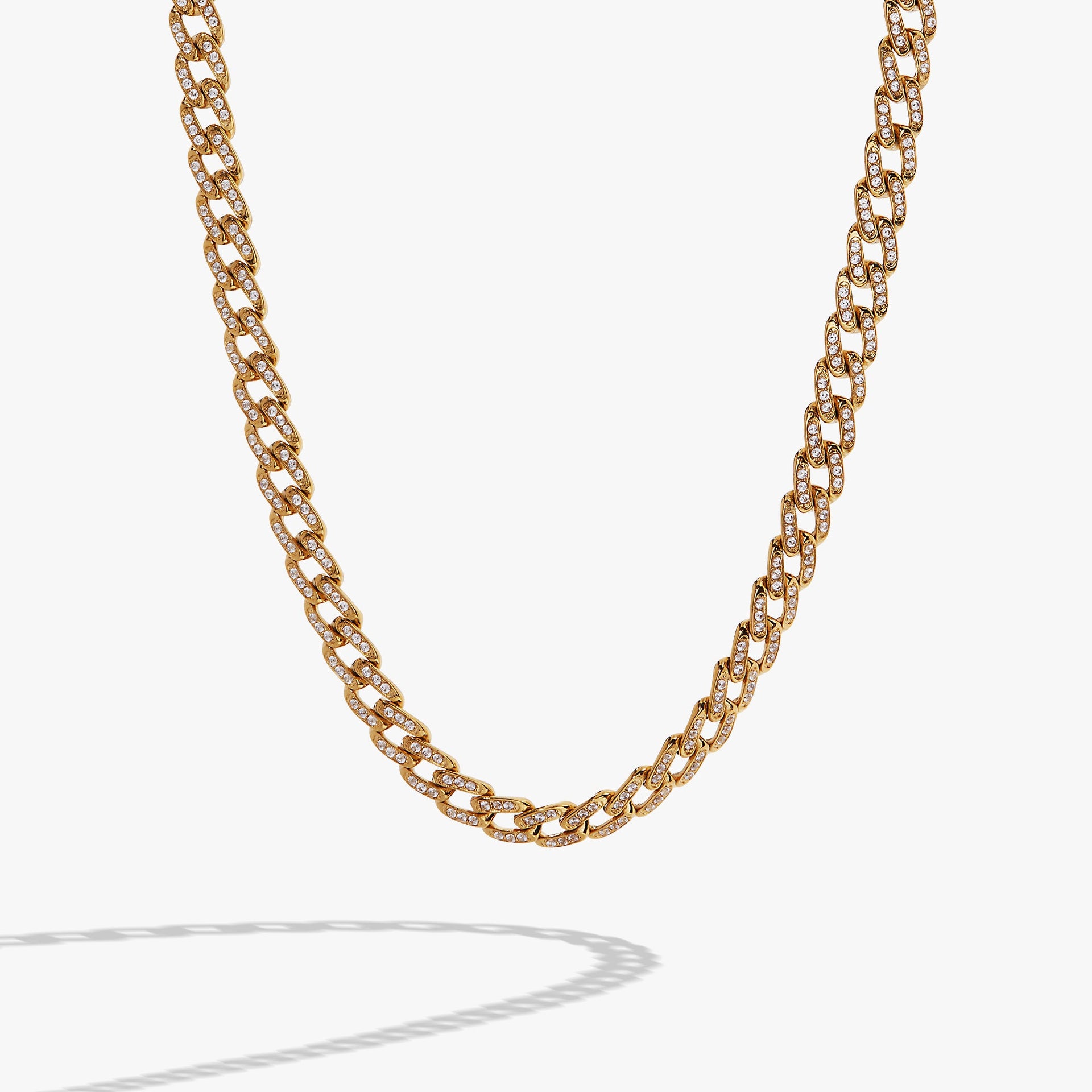 Gold chunky curb chain necklace with pave crystal accents styled for modern glamour