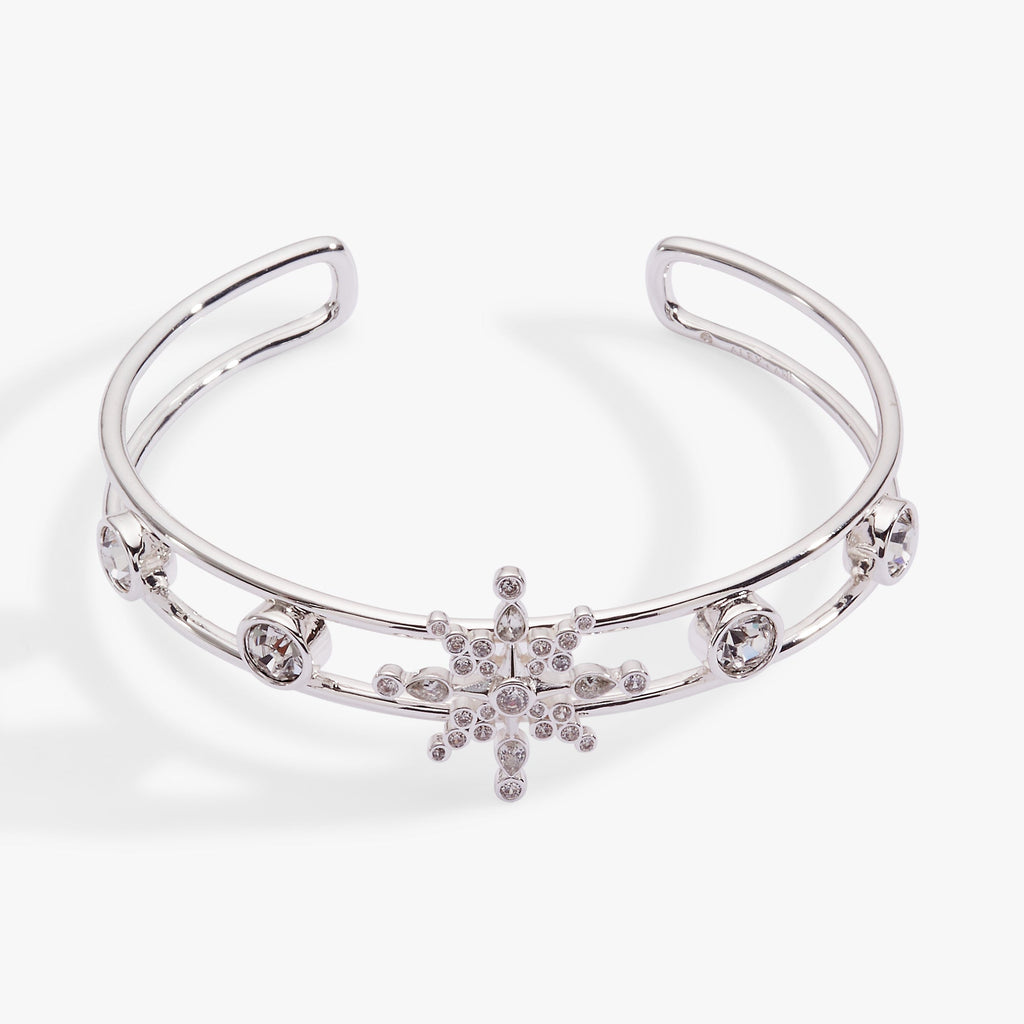 Silver openwork cuff bracelet with a prominent crystal snowflake and pave stone details.