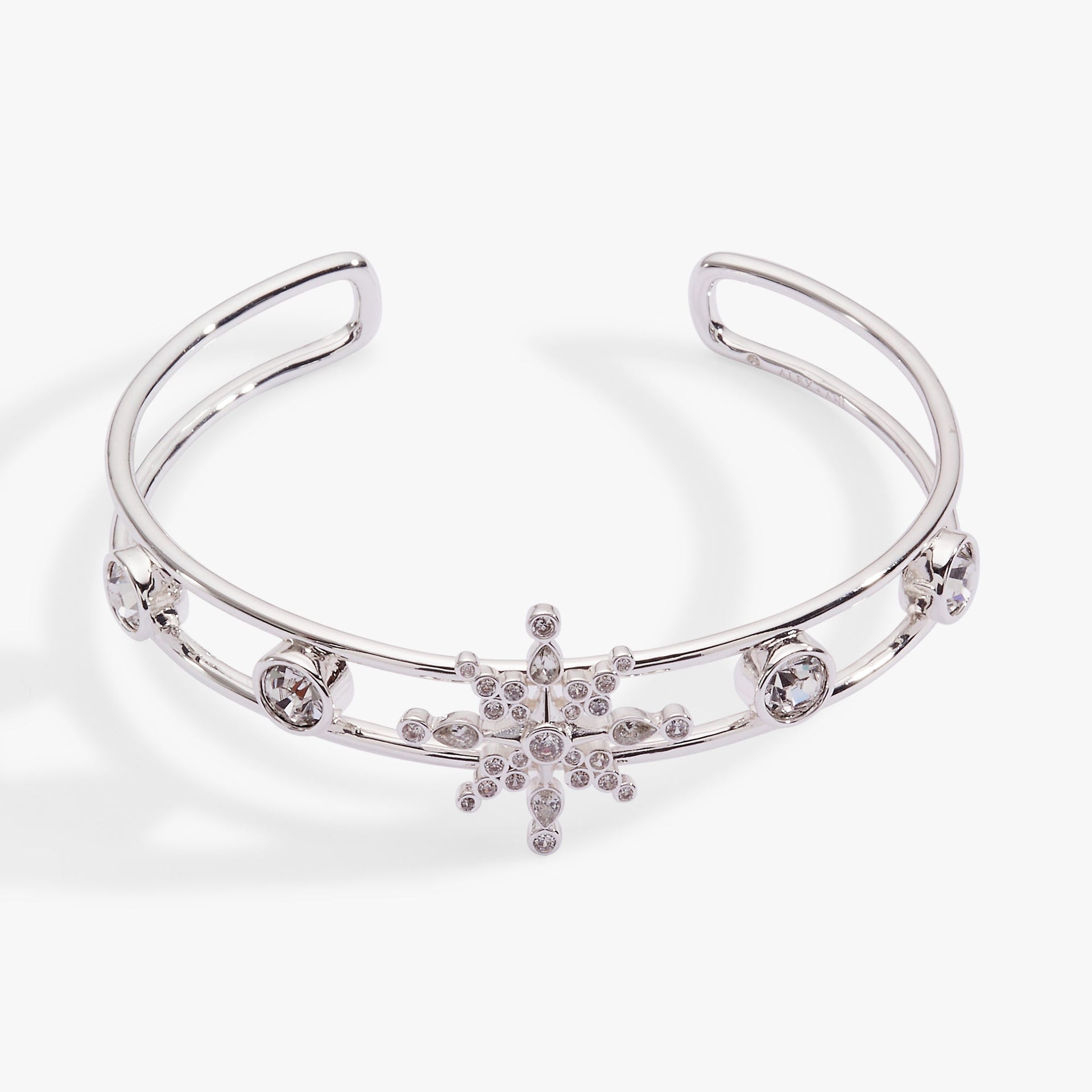 Silver openwork cuff bracelet with a prominent crystal snowflake and pave stone details.