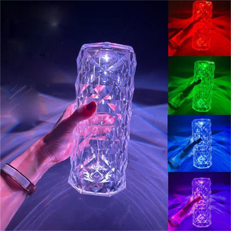 Crystal diamond-style table lamp casting romantic light patterns on a surface.