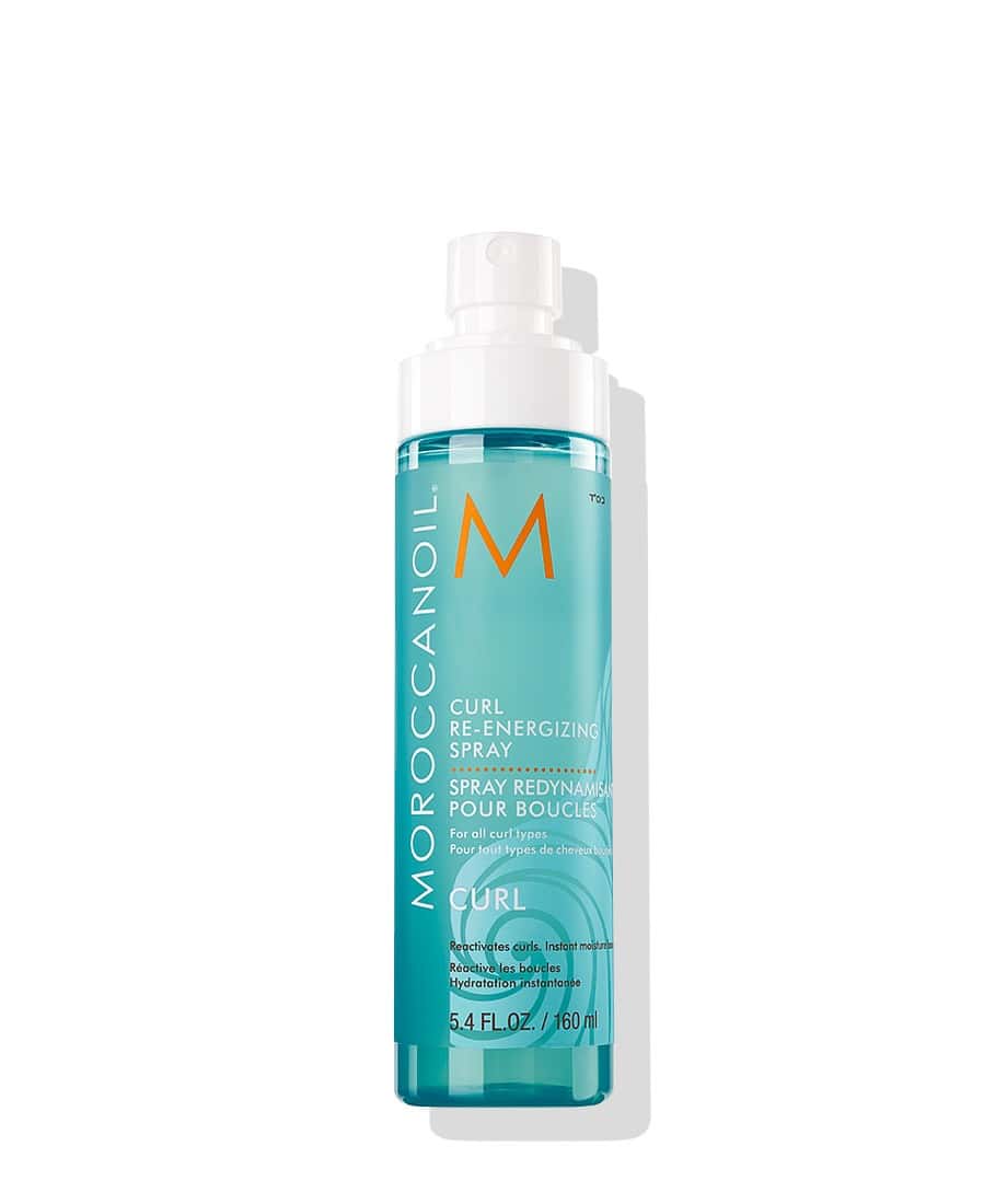Bottle of Moroccanoil Curl Reenergizing Spray for refreshing and defining curly hair.