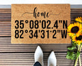 Customized brown and black coordinate doormat on a neutral porch entryway