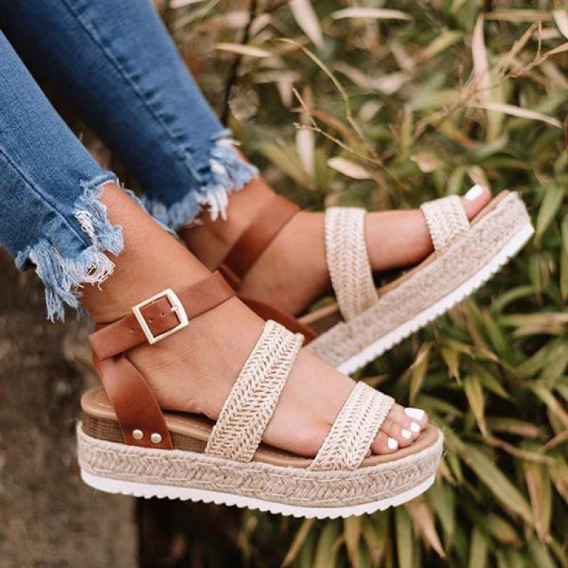 Golden platform sandals with cross-strap ankle design and open-toe style