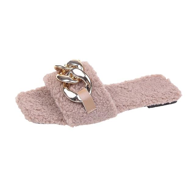 Women's square toe slide sandals featuring a decorative chain detail on the strap in a flat, casual style.