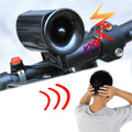 Compact black electronic bicycle horn with multi-sound functionality mounted on a road bike handlebar.