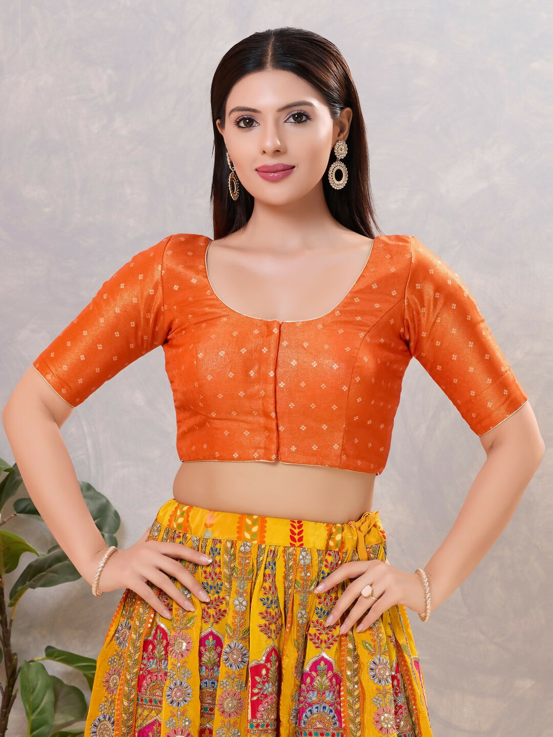 Women's Orange Silk Round Neck Stitched Blouse in smooth fabric
