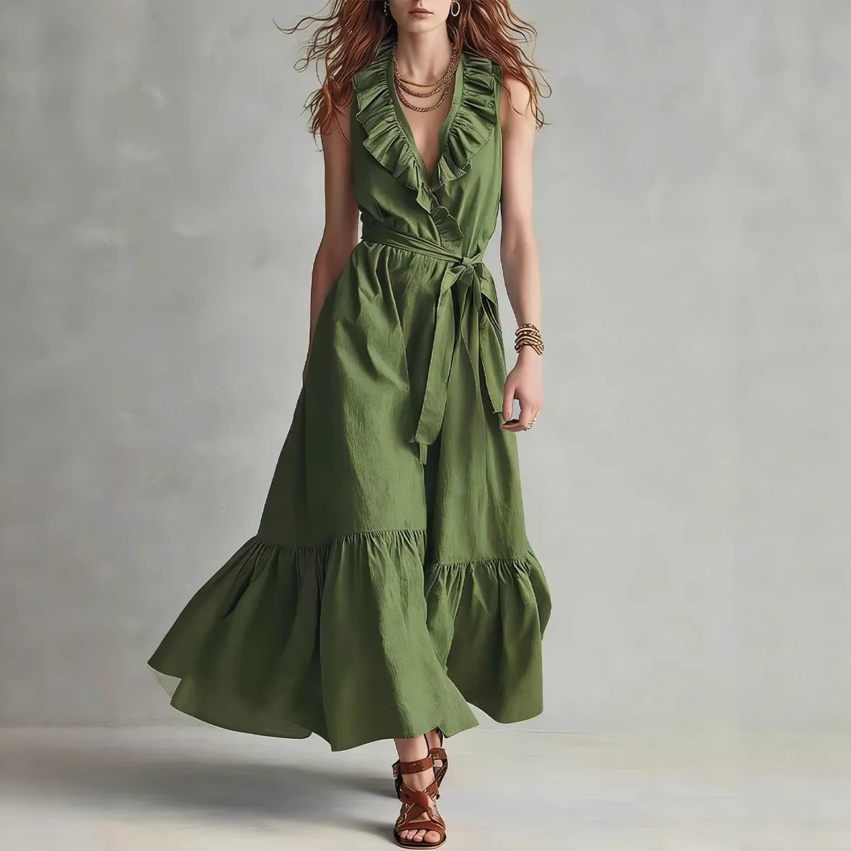 A woman wearing a sleeveless maxi dress with a ruffled V-neck and tie-waist in olive green and dusty pink color options.