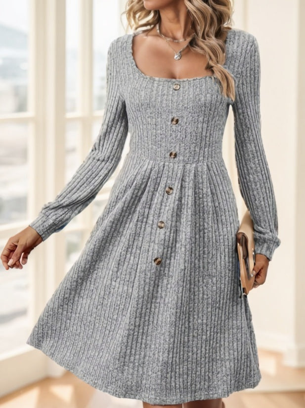 Woman wearing a heathered cool-toned grey long-sleeve ribbed knit midi dress with button details.