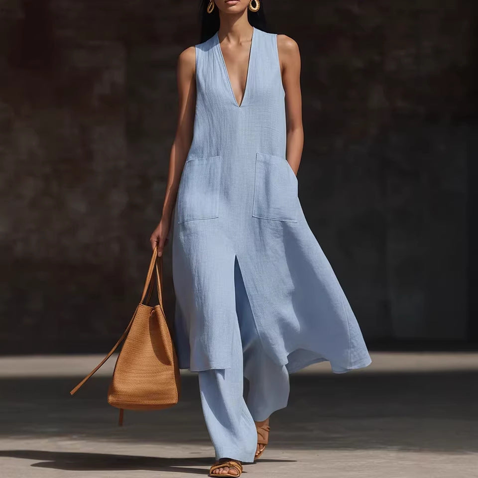 A woman wearing a solid color sleeveless linen V-neck tunic with two pockets and matching wide-leg pants.