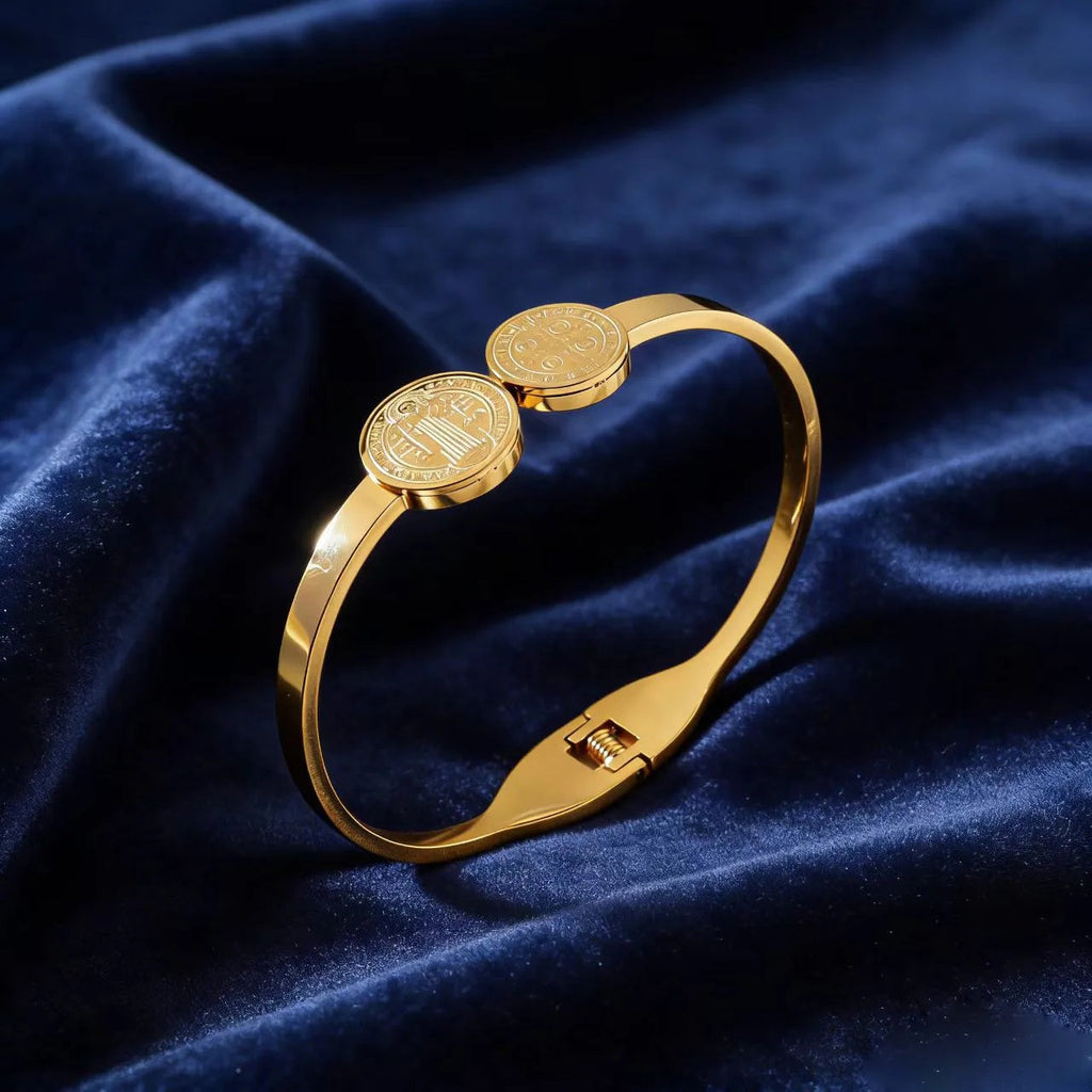 A polished gold stainless steel religious priest spring hinge bracelet on a clean white background.