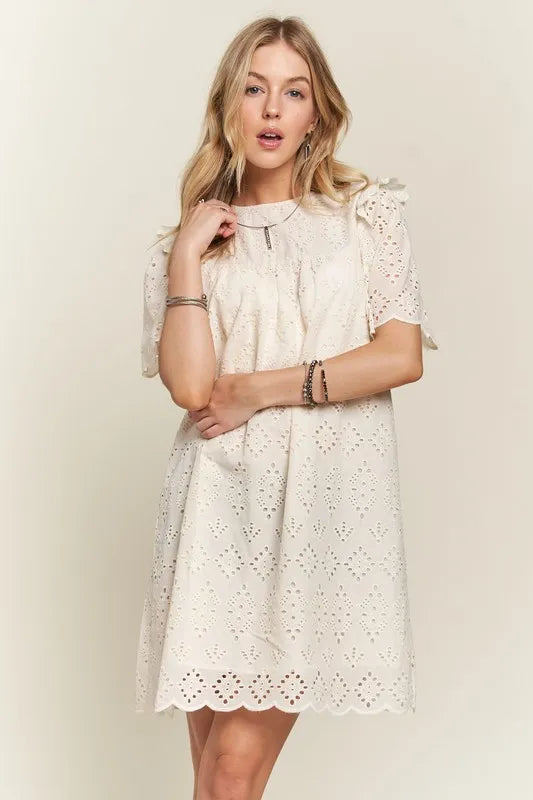Ruffled eyelet round neck summer dress featuring feminine ruffle details