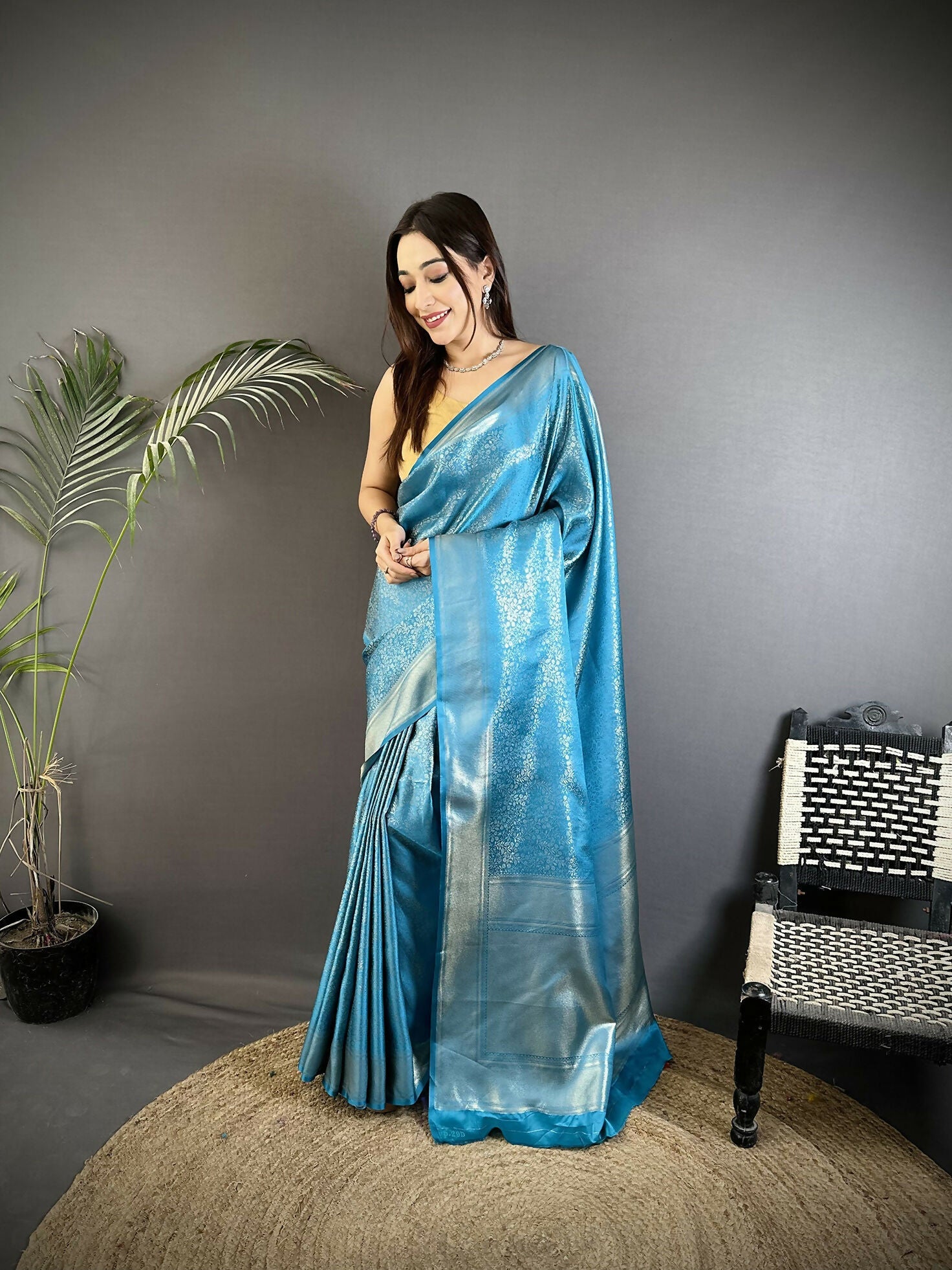Ocean blue soft satin silk Kanchipuram saree with floral ethnic motifs